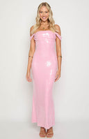 Blonde model wearing a pink sequin off shoulder gown paired with a white handbag and heels